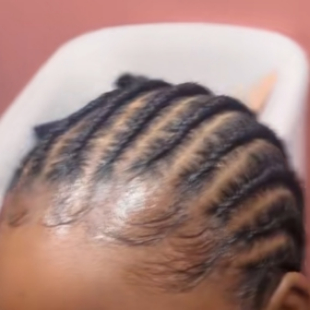 Wig braid down at Smiles & Styles in Sioux City, IA