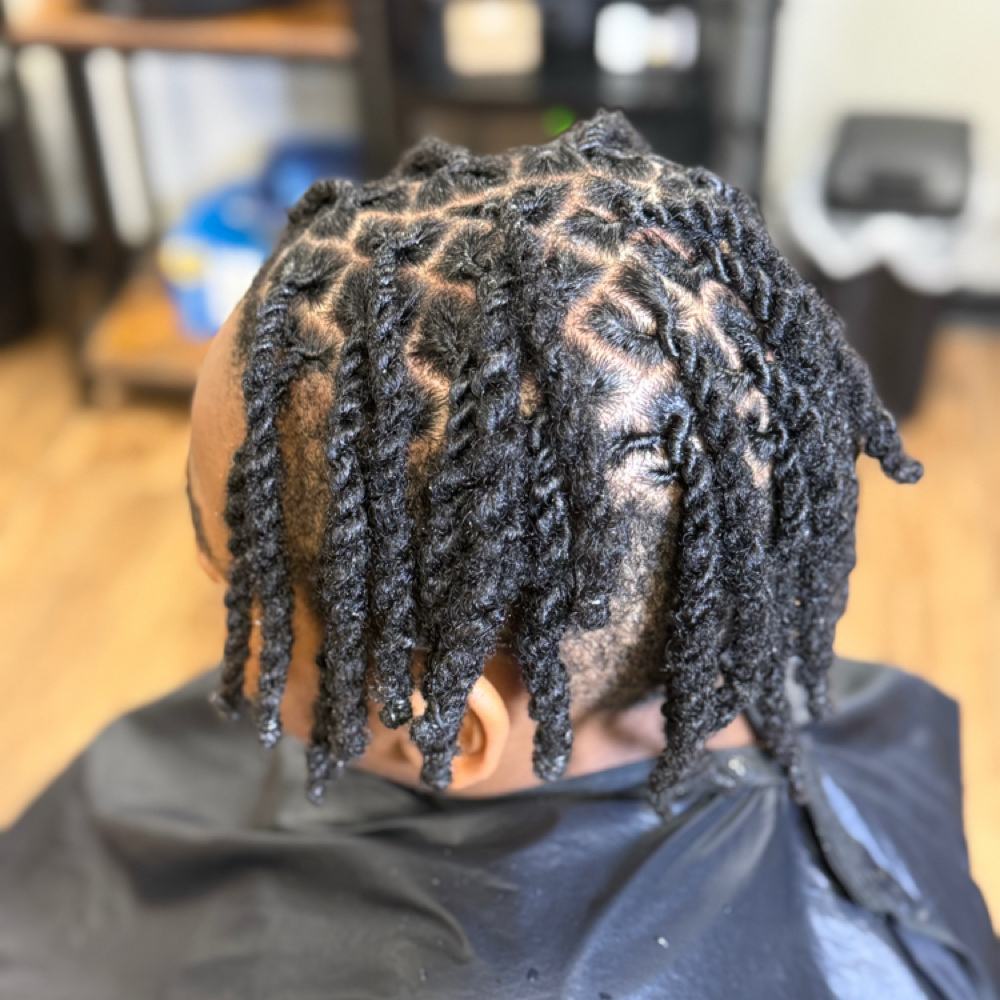 Kids 6-10 Loc Retwist & Two Strands at Elegance Redefined in Belden, MS