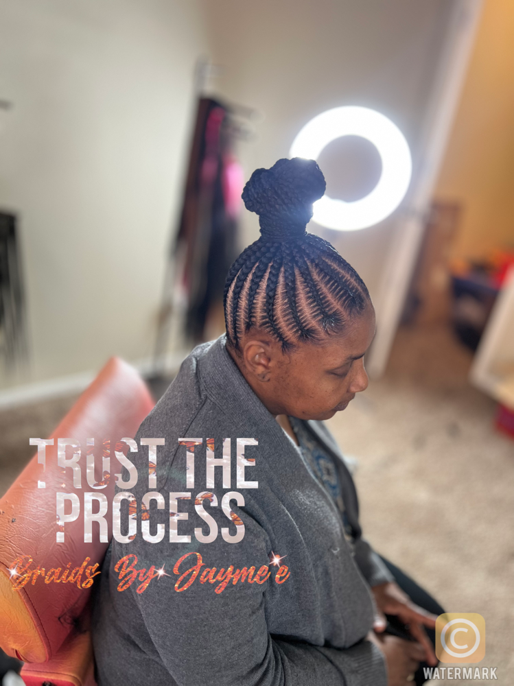 Medium Stitch Braids With Bun.