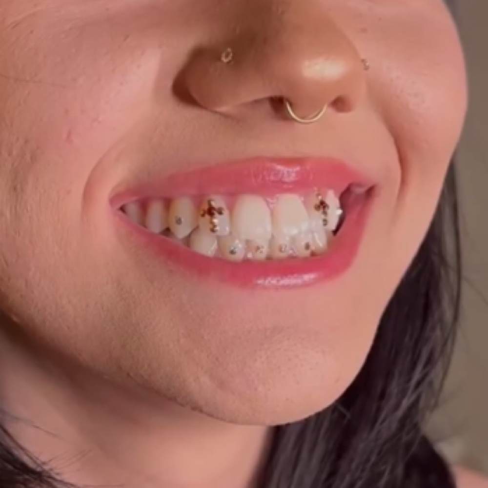 Cross Gemmed Tooth at Princesaa Piercings x Aesthetics in Chandler, AZ