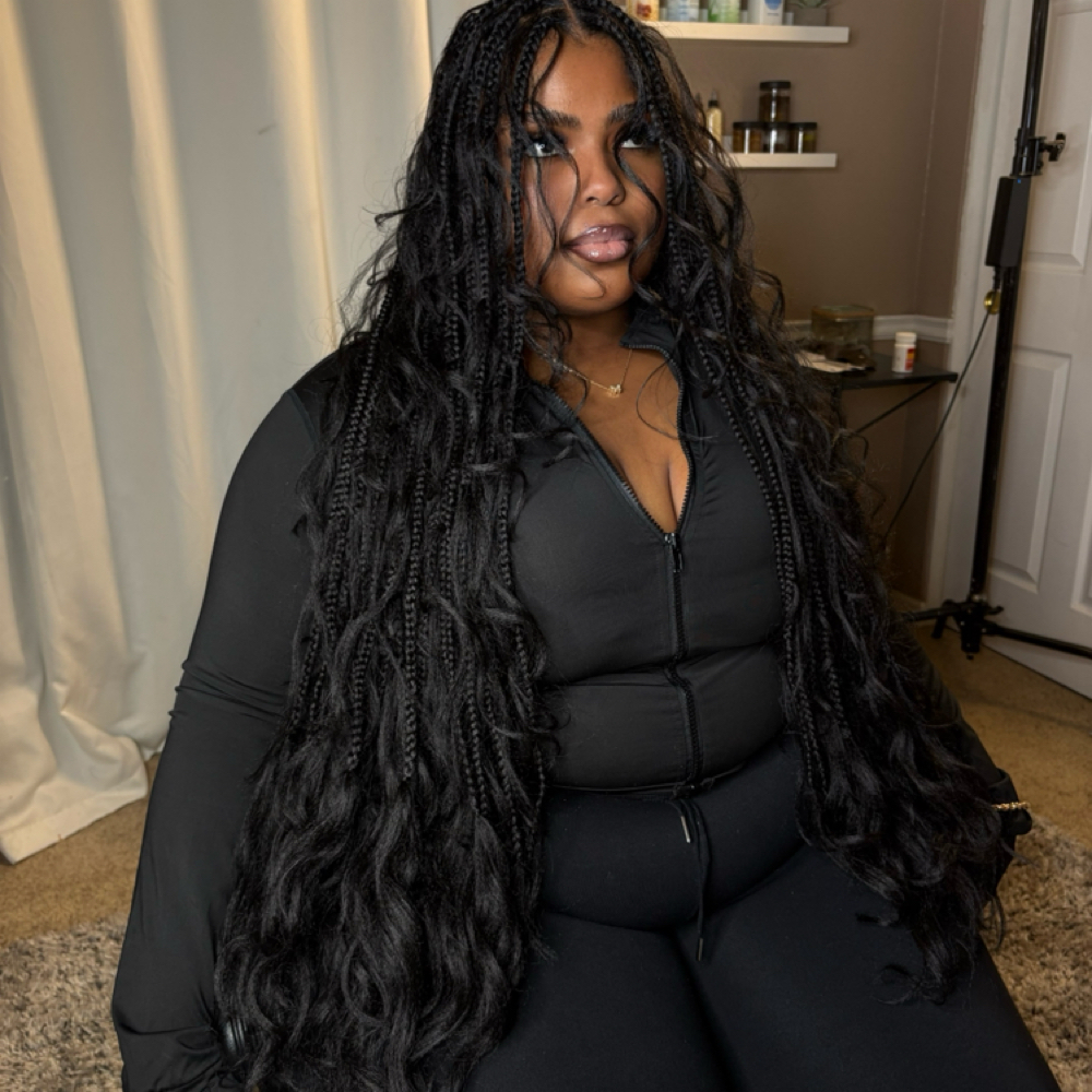 Custom French Curl Knotless Braids at The Arie Beauty Bar in Sacramento, CA