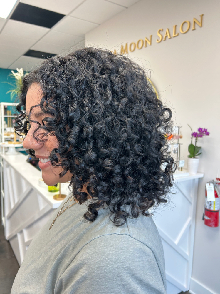 Ouidad Medium length Curly Haircut