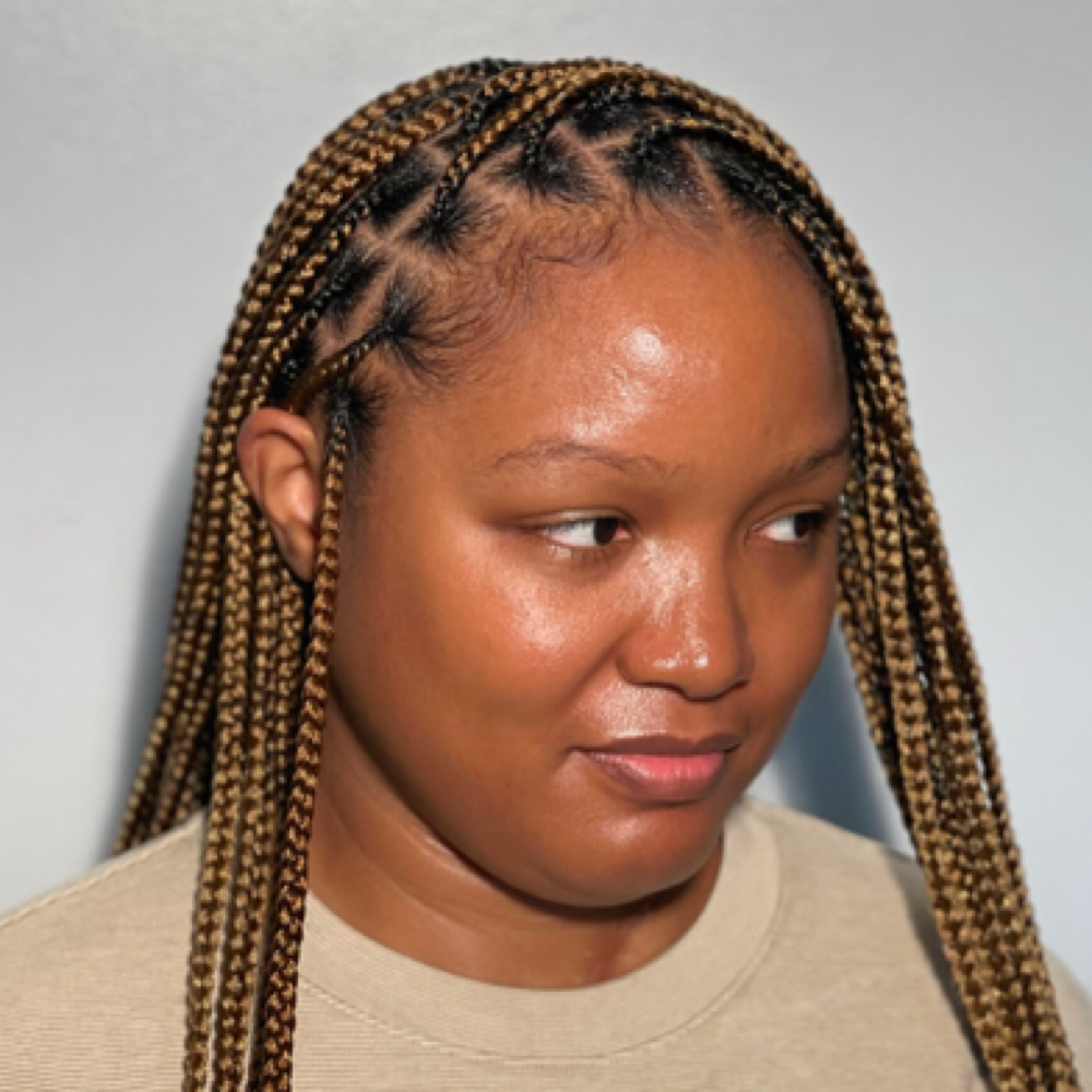 Medium Knotless – Mid-Back Length at Haus Of Kartel in Rochester, NY