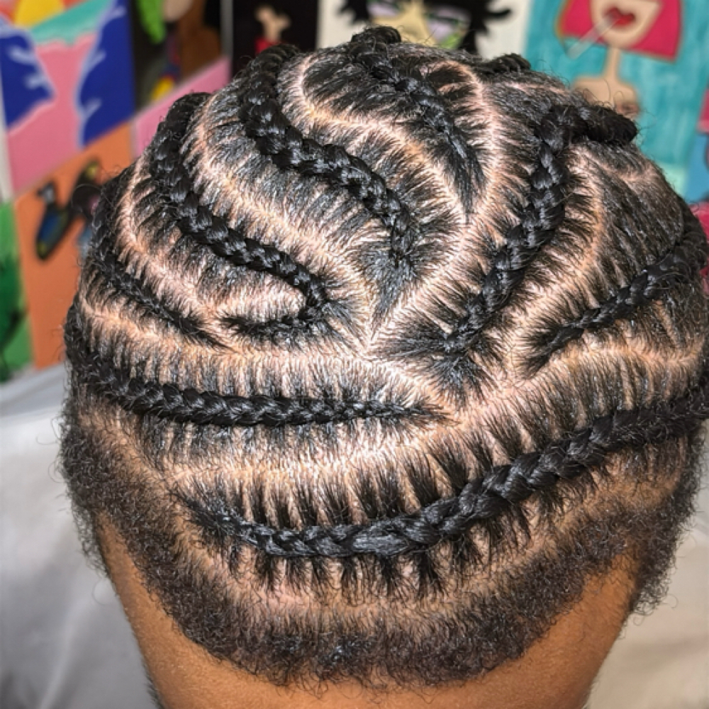 Men stitch braids at Knotless By Mya in union city, GA
