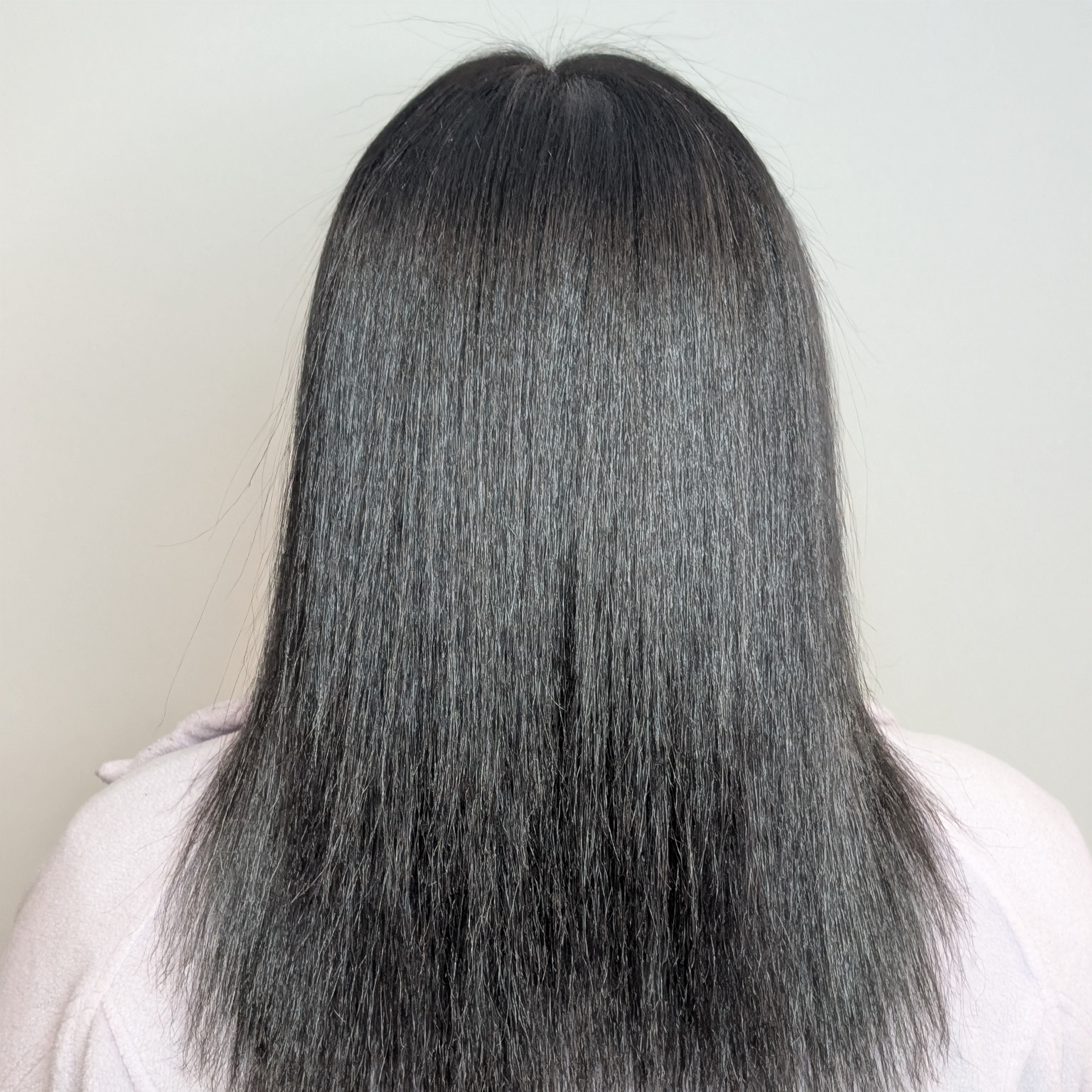 Frizz-free Smoothing Treatment at Dimensions Hair Studio & Spa in East Patchogue, NY