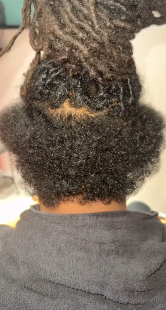 Loc reattachment at Loc’d N Wit Tweet in Temple Hills, MD