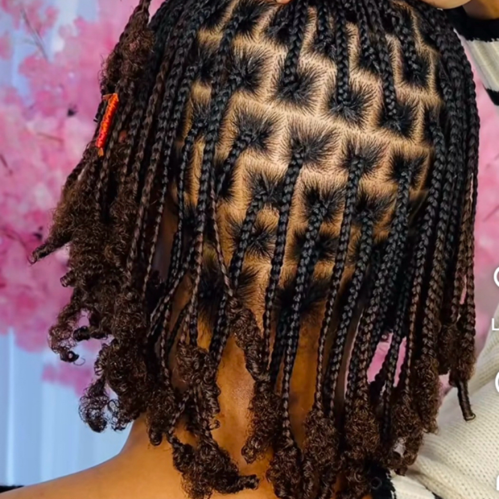 Smedium braids on natural hair at Afrokreyol braiding salon in Plantation, FL