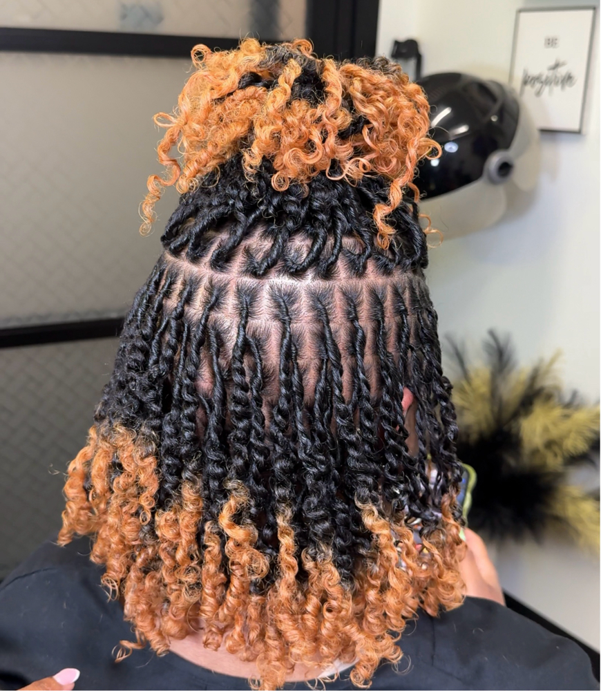 Starter locs (medium length hair) at Otusbeauty in Greenbelt, MD