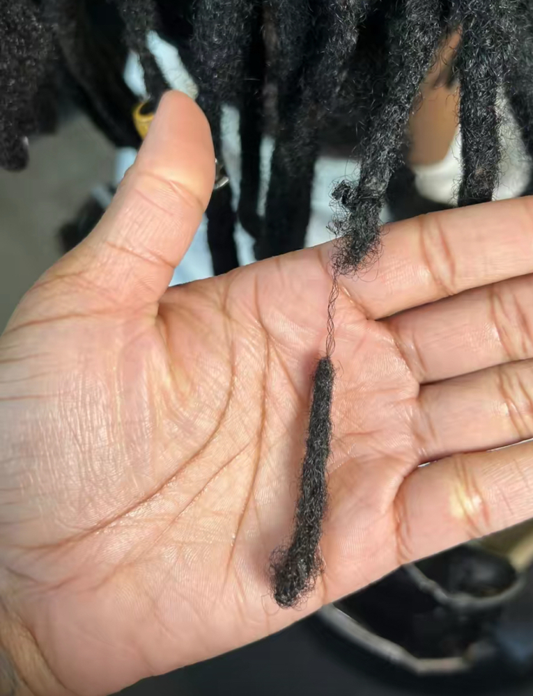 Loc repair and restoration at The Braid Boutique 706 in Augusta Ga, GA