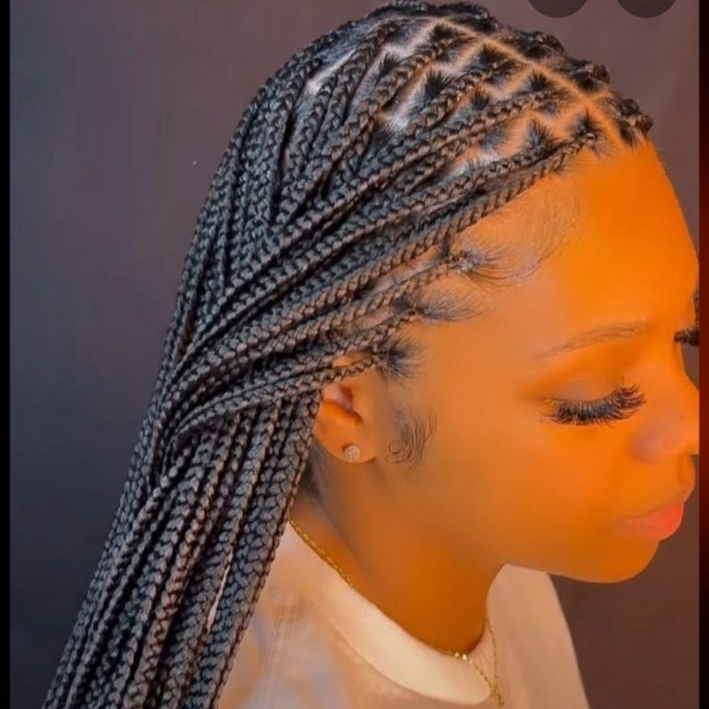Medium Knotless waist length at ROOTS HAIR By Nene in Philadephia, PA