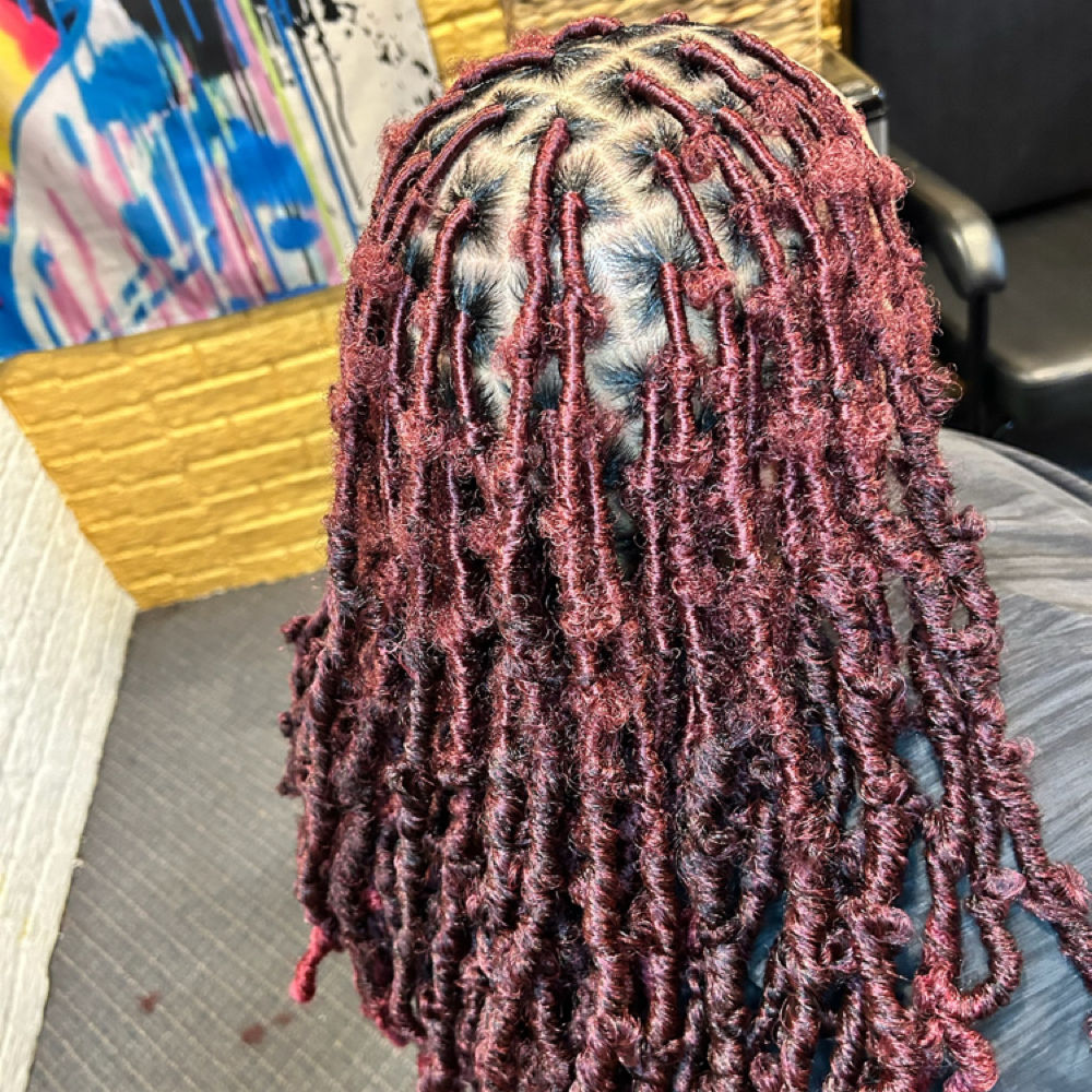 Butterfly faux locs On Natural Hair at Locs O’ Luv by Nola in Bloomington, IL
