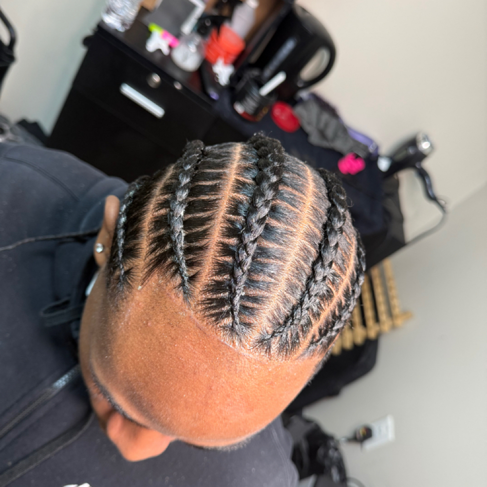 Men / Boys Six Stitch braids at Faith TheBraider in Milwaukee, WI