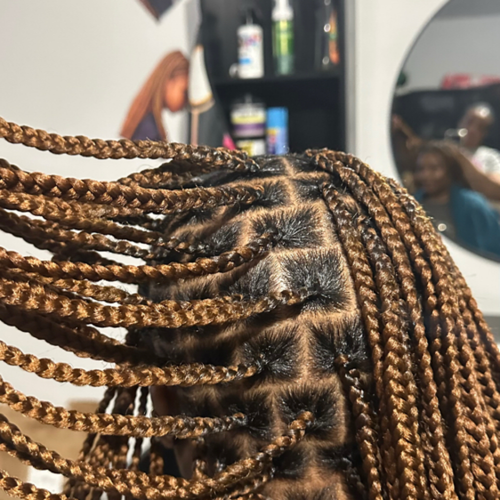 knotless Braid (Medium Mid-back) at Gigi African Braids Houston in Cypress, TX