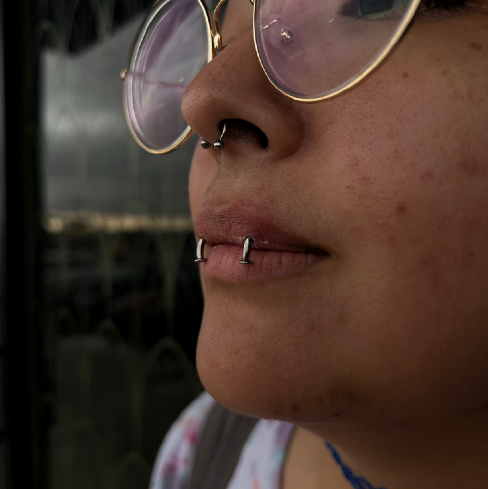 kitten fangs at Artistry Tattoo & Piercing Parlor in San antonio, TX