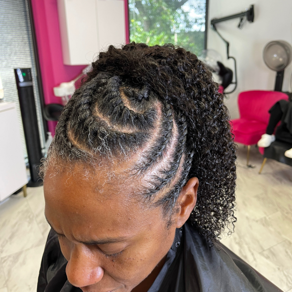 Flat Twist Updo With Hair Added at Gorgeous Strands Natural Hair Salon in Houston, TX