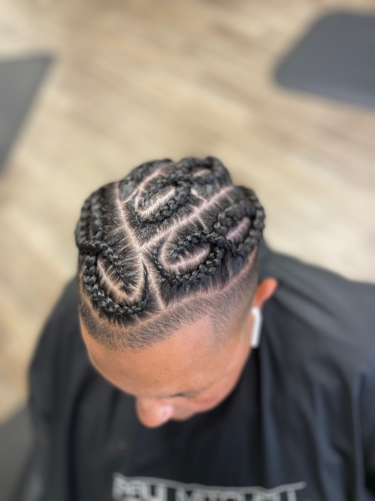 Man Bun Cornrows at Crown Adjustments in Havelock, NC