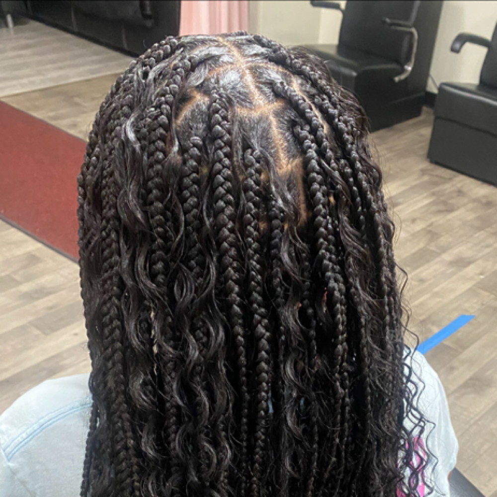 Medium Boho Knotless Mid Back at Crowned Braids Salon in Conway, SC