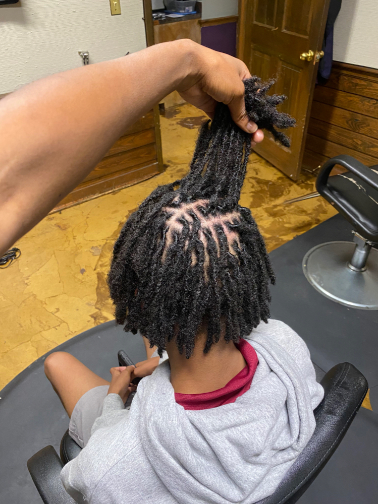 Loc Retwist at Glamour Assassin in Jackson, MS