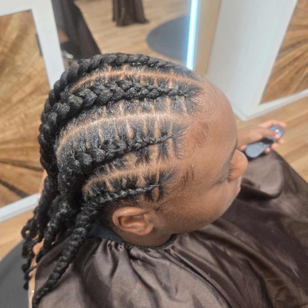 Stitch braids with hair added at The collective salon and barber spa inc in Locust Grove, GA