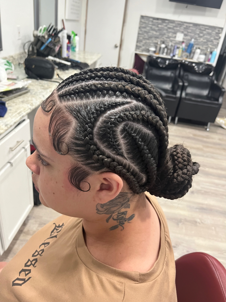 Alecia keys braids (bun) at The Hairapist Experience in Mount morris, MI