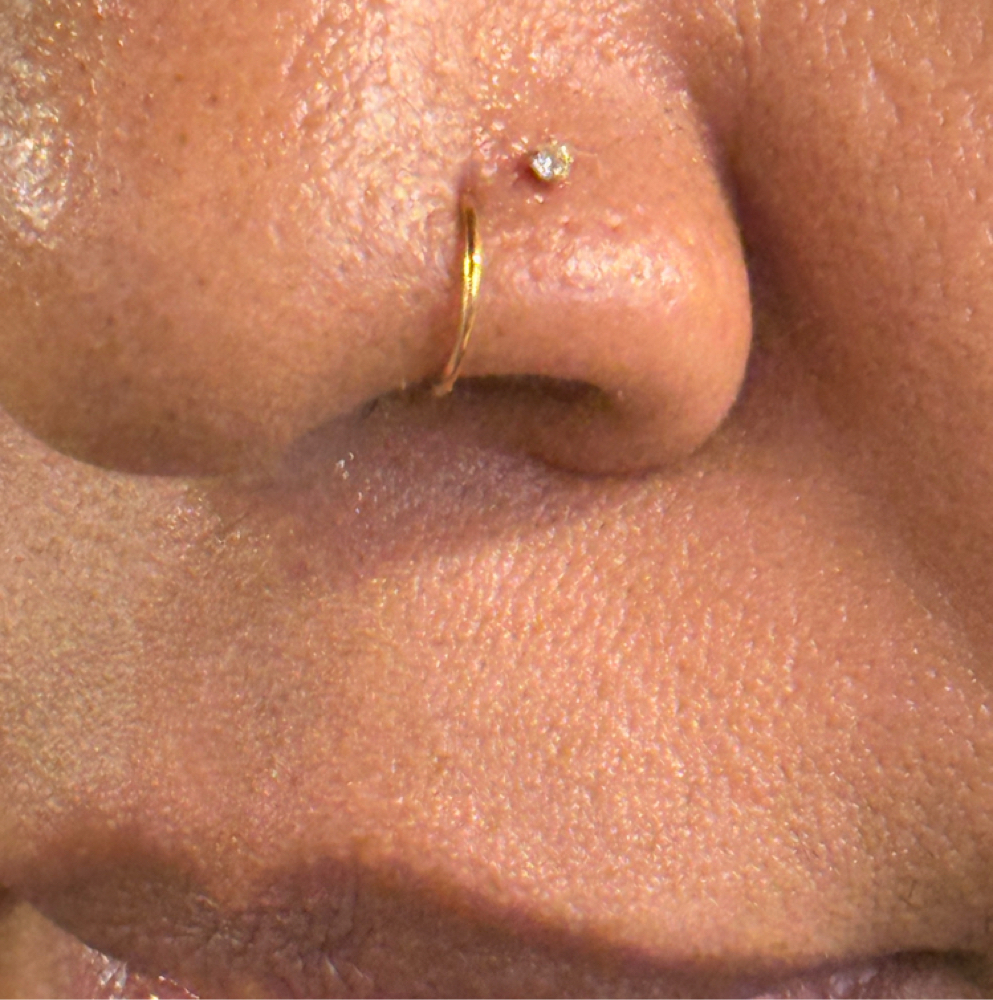Jewelry Change or Removal at 2 Layers Deep Tattoo Co. in Charlotte, NC