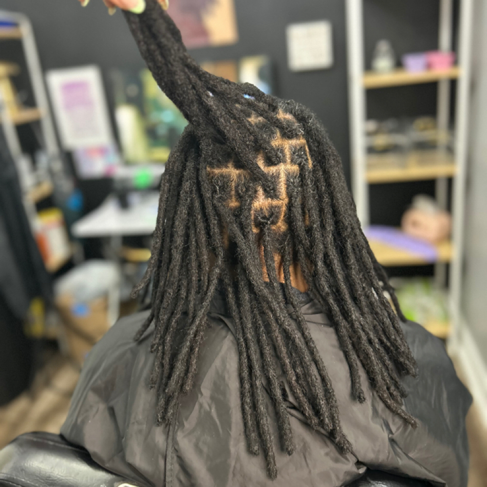 Interlock Loc Maintenance at Curl Conscious by Nique in Raleigh, NC