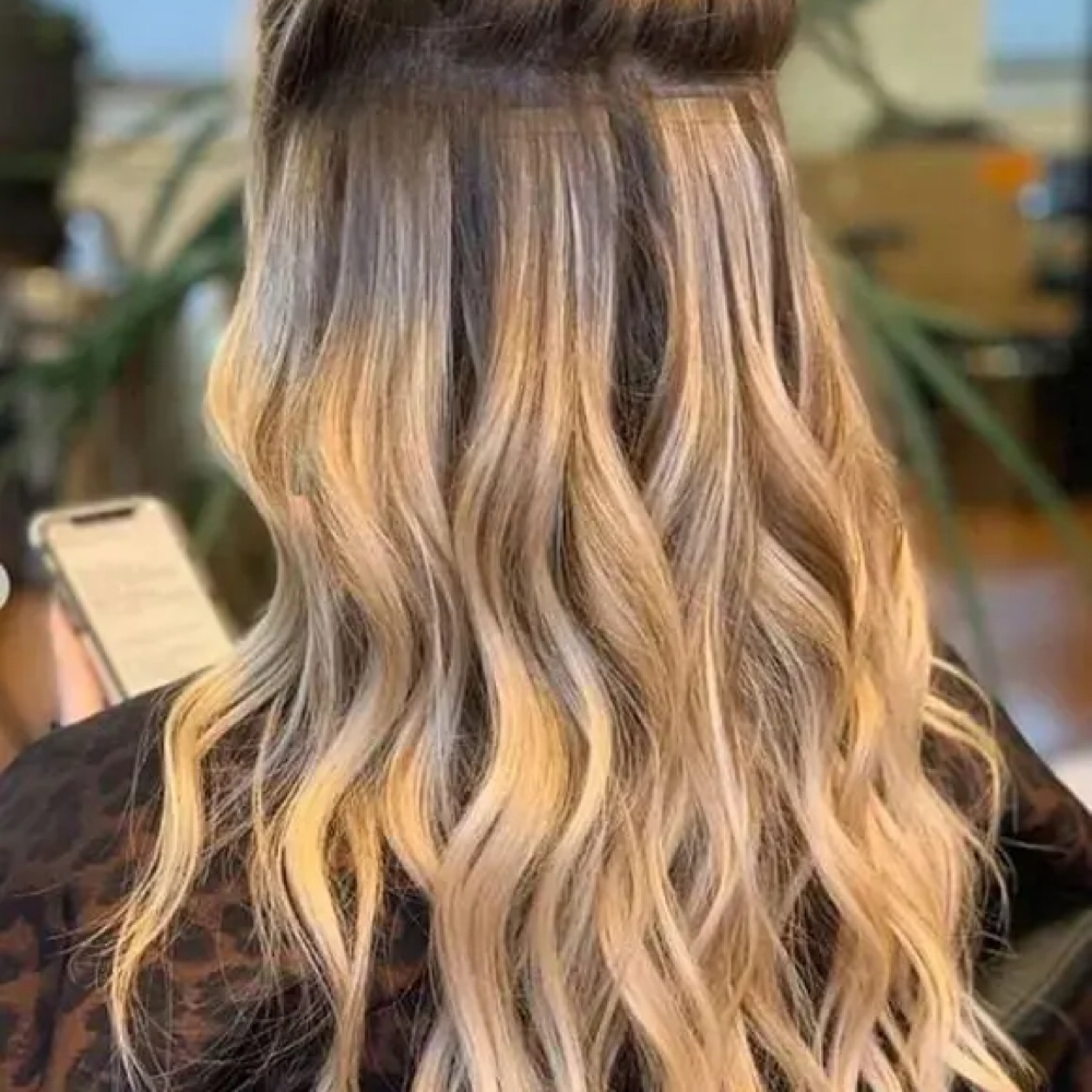 Extension Install Tape in at Beauty Blowout Bar Salon in San Antonio, TX