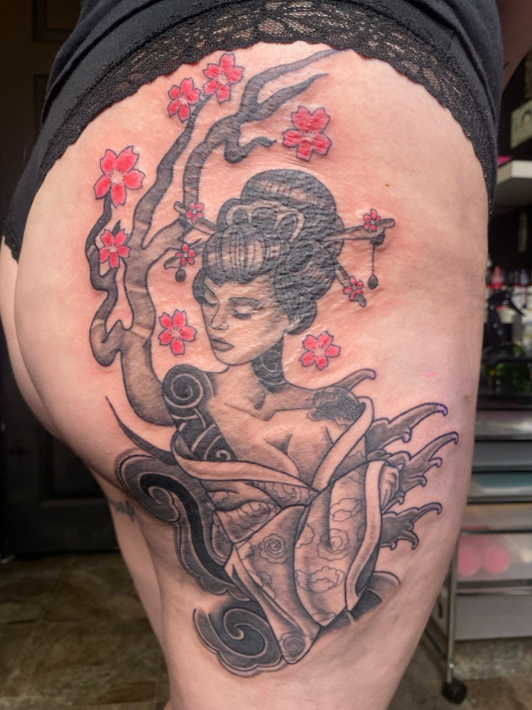 Thigh tattoo