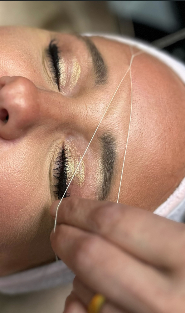Eyebrow threading
