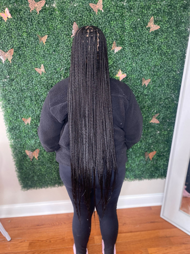 Small Calf Length Knotless Braids at K.M.H.&S. Braiding in Chicago, IL