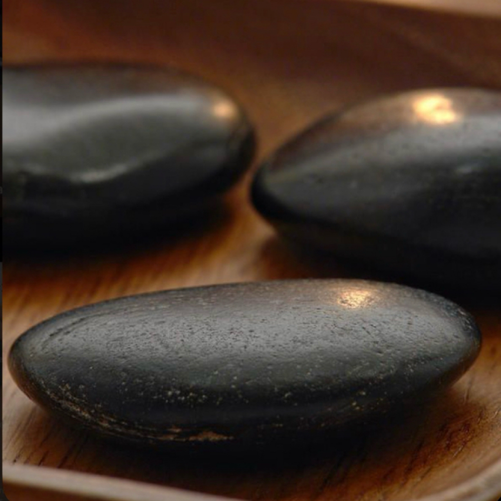 Hot Stone at Rooted Touch Wellness in Greensboro, NC