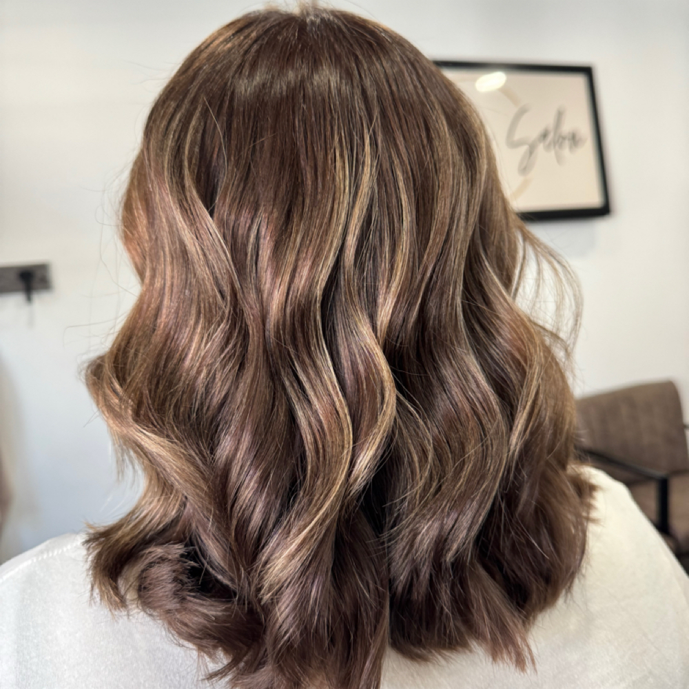 Long hair Highlight All Over with base color retouch at Serenity Salon in Akron, IA