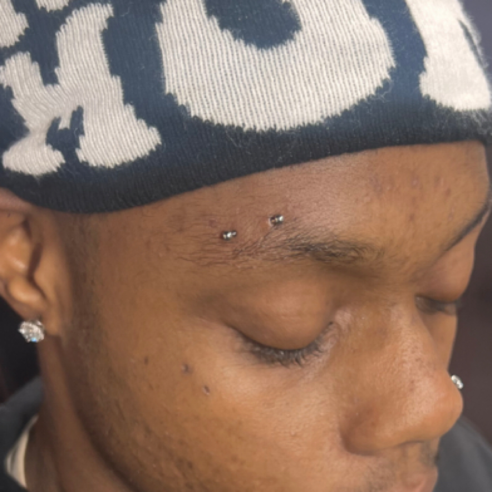 Eyebrow Piercing at Candi Coated Ink in Detroit, MI