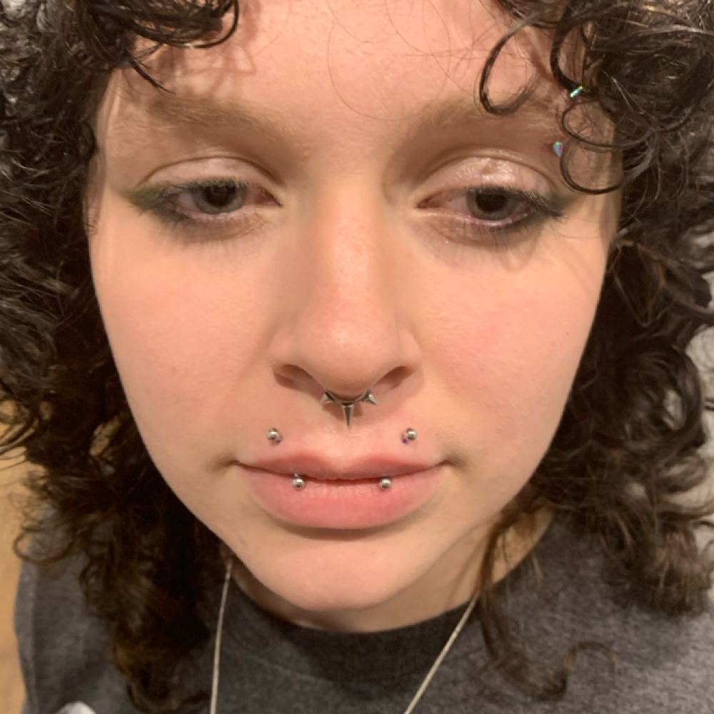 Angel Fangs (upper Lip) at Calico Creek Tattoo Co. in Wichita, KS