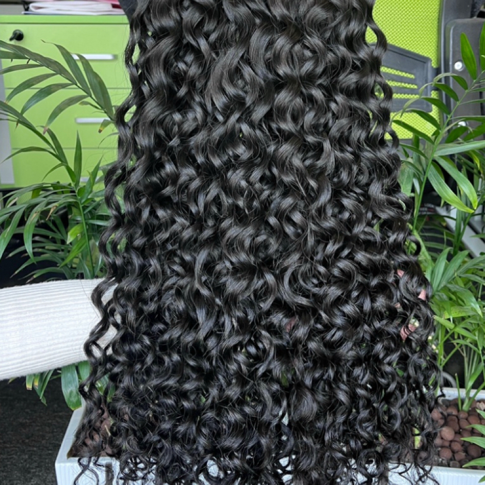 Sew In ( Curly Bundles) at HairChroniclez in Alameda, CA
