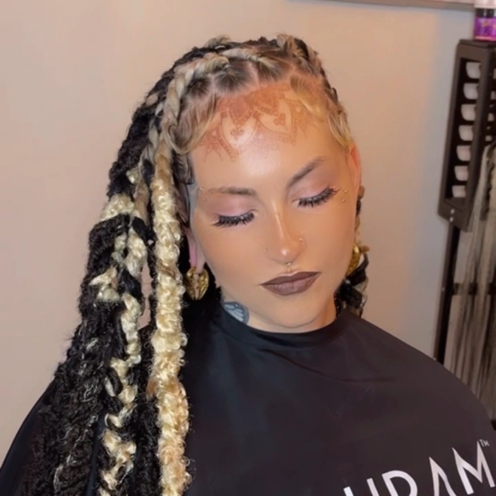 Braids over locs at Freedom Bound Studio in Raleigh, NC