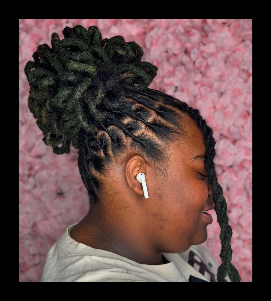 Petal Bun at Exquisite Locs by Chrissy in Memphis, TN