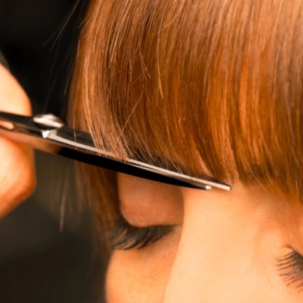 Bang Trim at Envy Waves Hair salon in North Port, FL