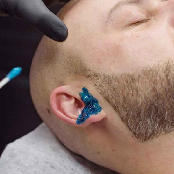 Ear Wax at The Rooted Barber in Lincoln, NE