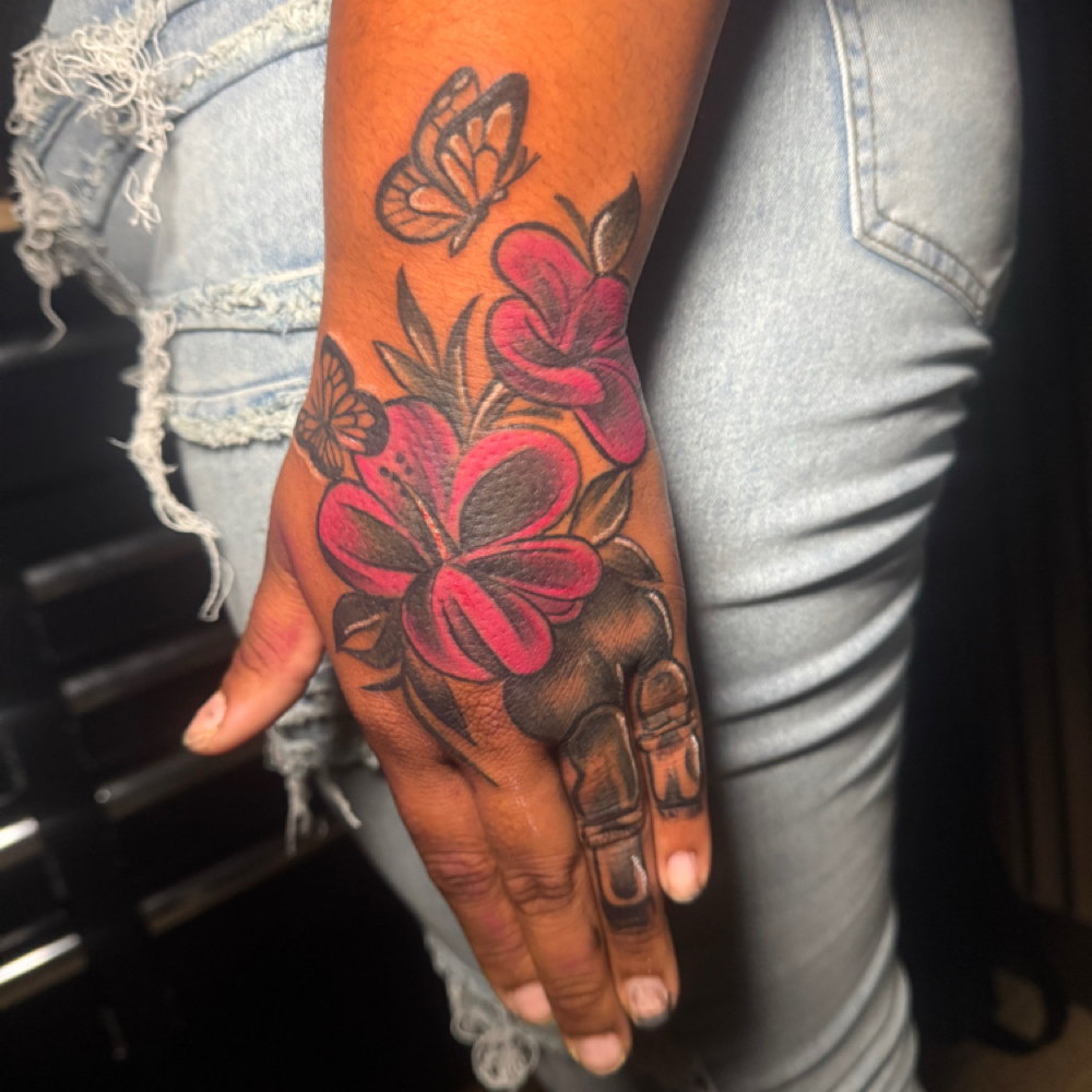 CUSTOM HAND TATTOO at Tattoo Whitney Houston in Houston, TX