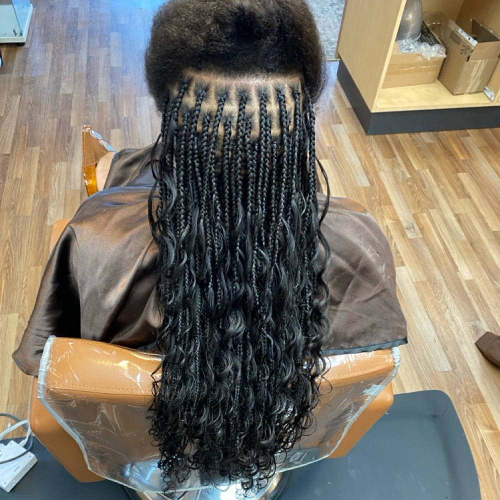 Smedium knotless braids at The collective salon and barber spa inc in Locust Grove, GA