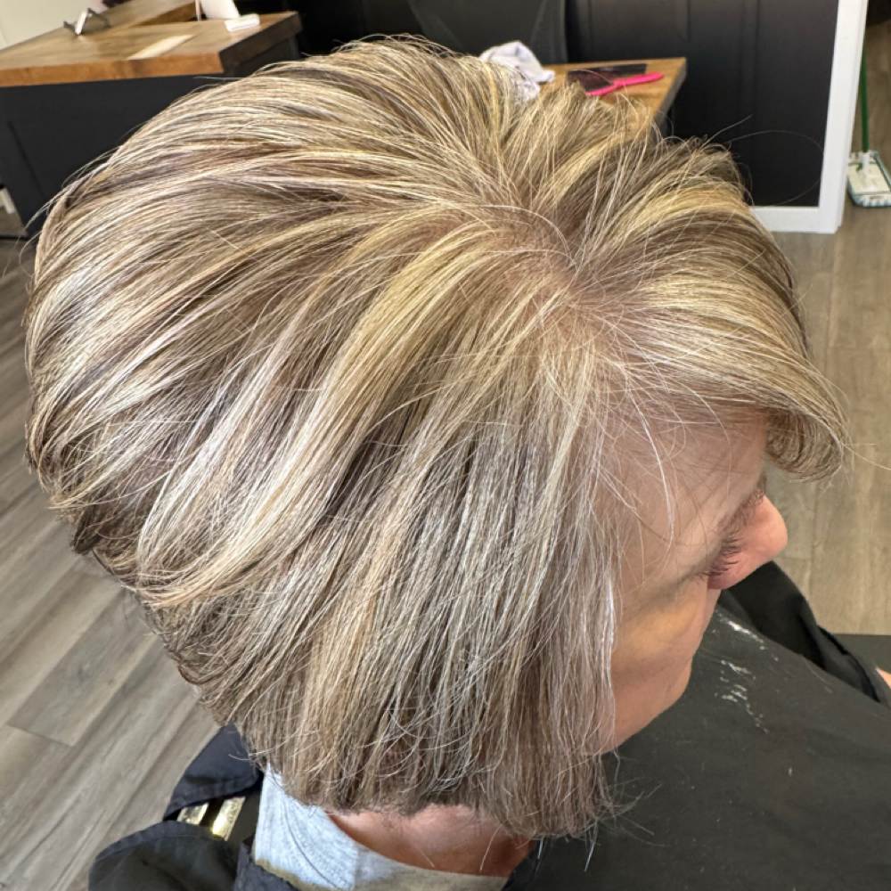 Short hair highlight all over with base color retouch at Serenity Salon in Akron, IA