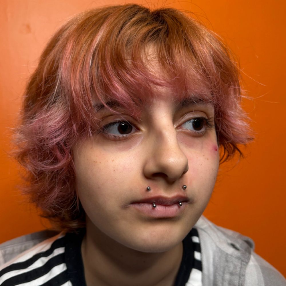 Angel Fangs at Revision Body Art in Covina, CA