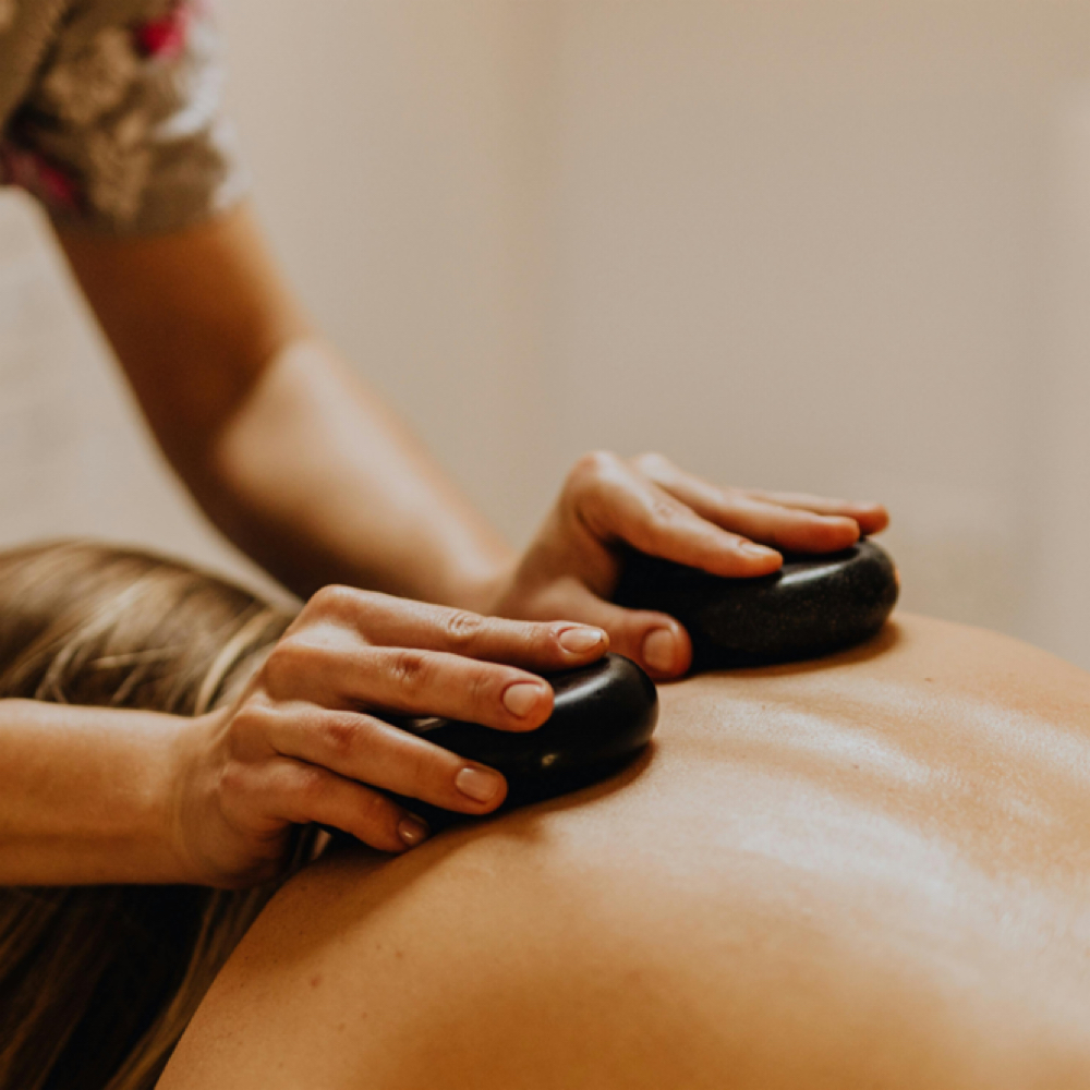 Hot Stone Massage at Body Works Massage + Wellness in Burlington, NC