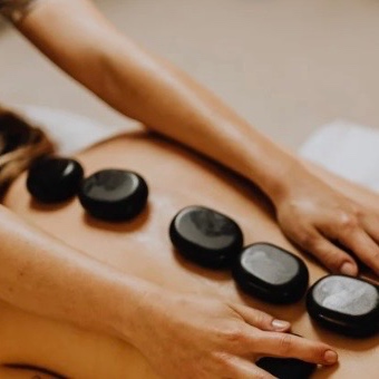 Hot Stone Massage (90 Mins) at The Loft Massage and Lymphatic Wellness in Saline, MI