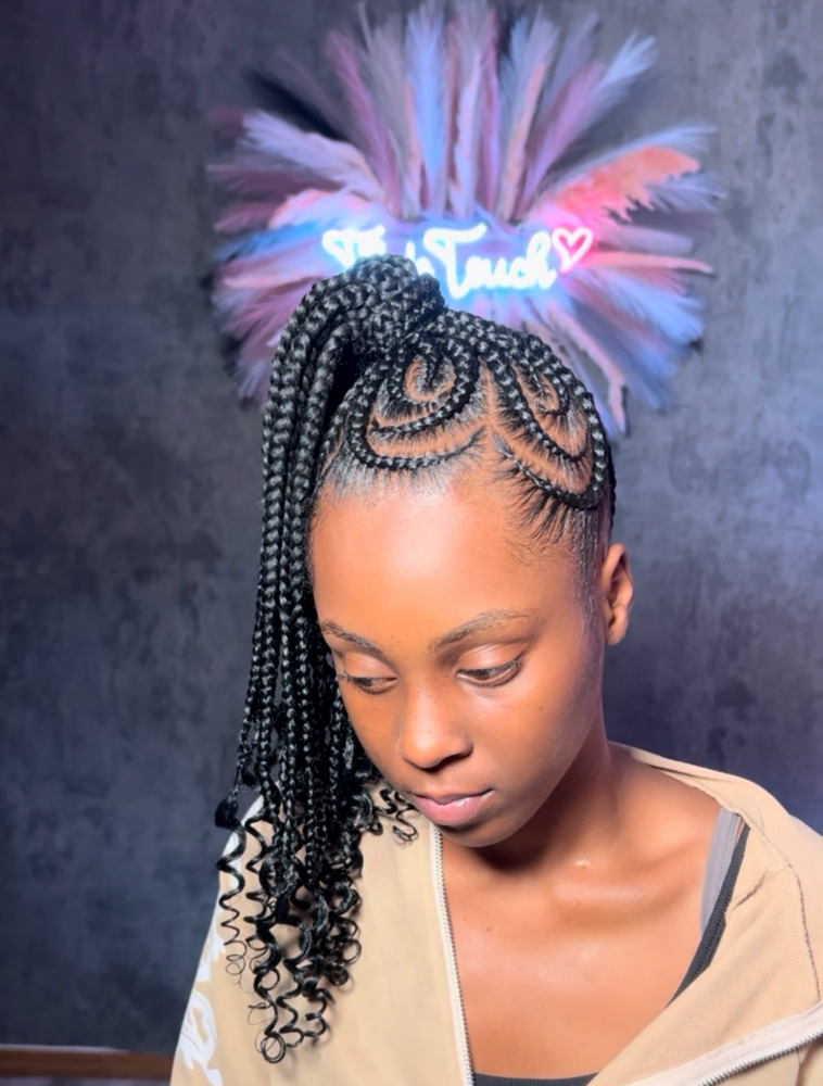 Braided ponytail with designs at Tia's Touch in urbana, IL