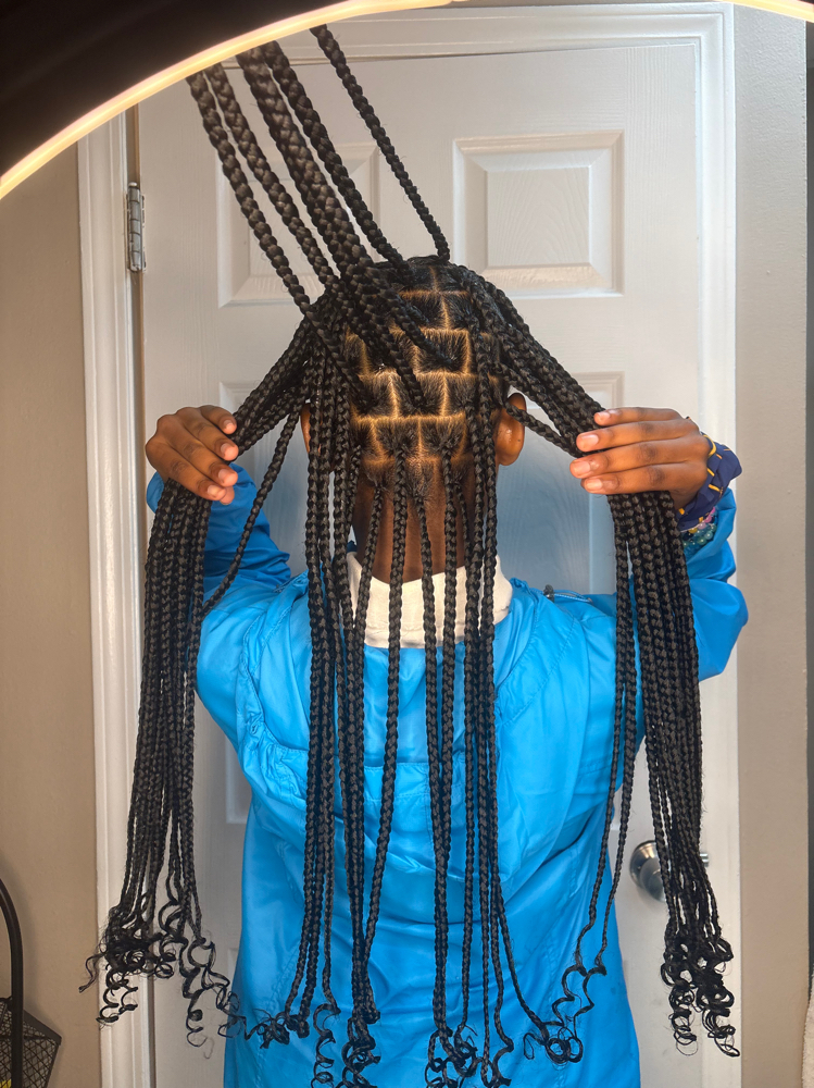 Medium Knotless Braids at Crowned Beauty Studios LLC in Detroit, MI
