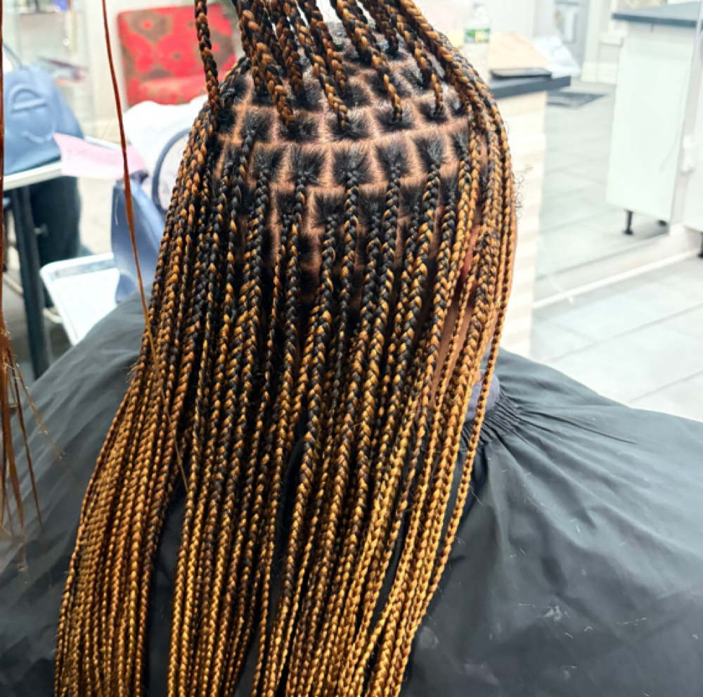 Smedium knotless waist length at ROOTS HAIR By Nene in Philadephia, PA