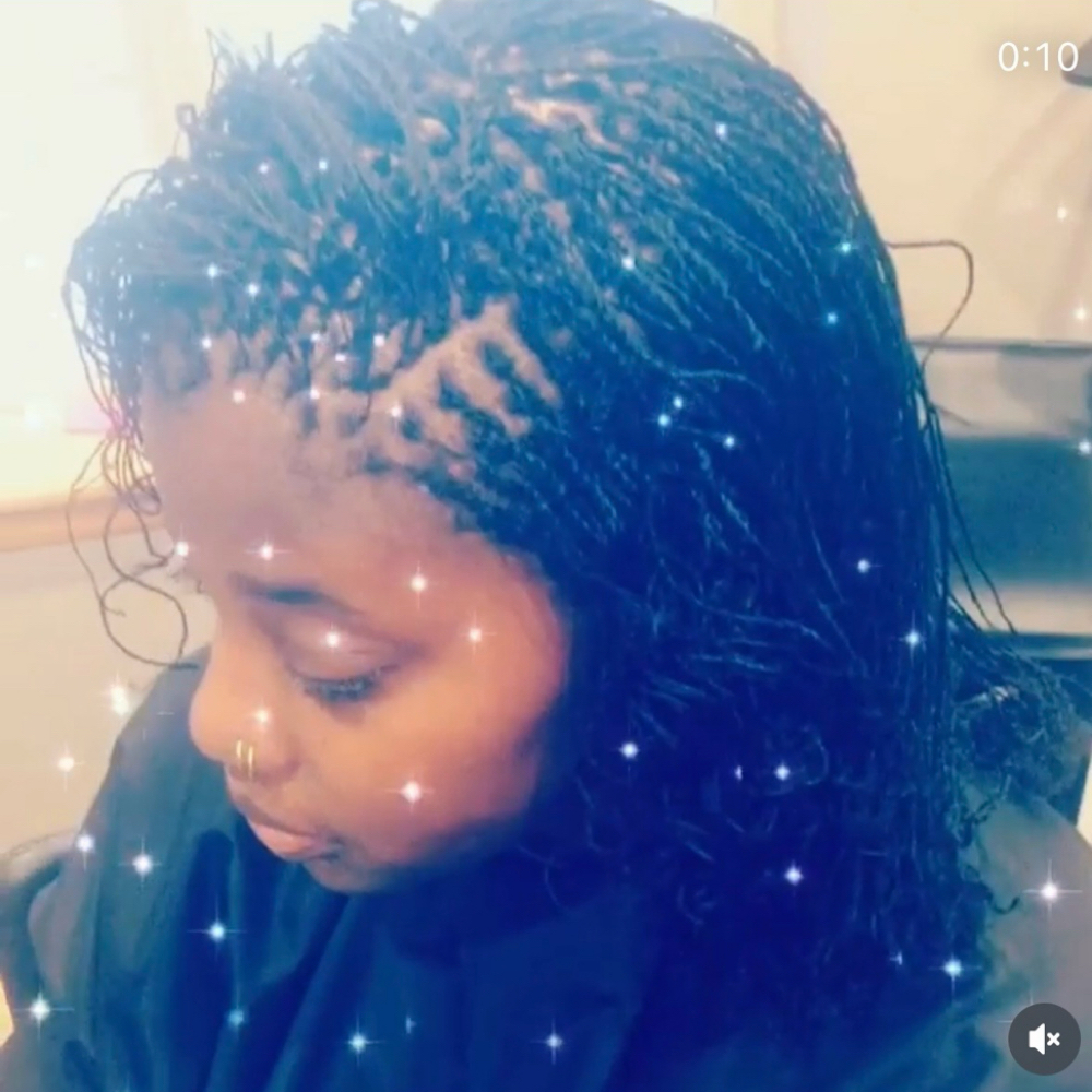 Sister Locs at DeeplyRootedSalon in Iowa City, IA