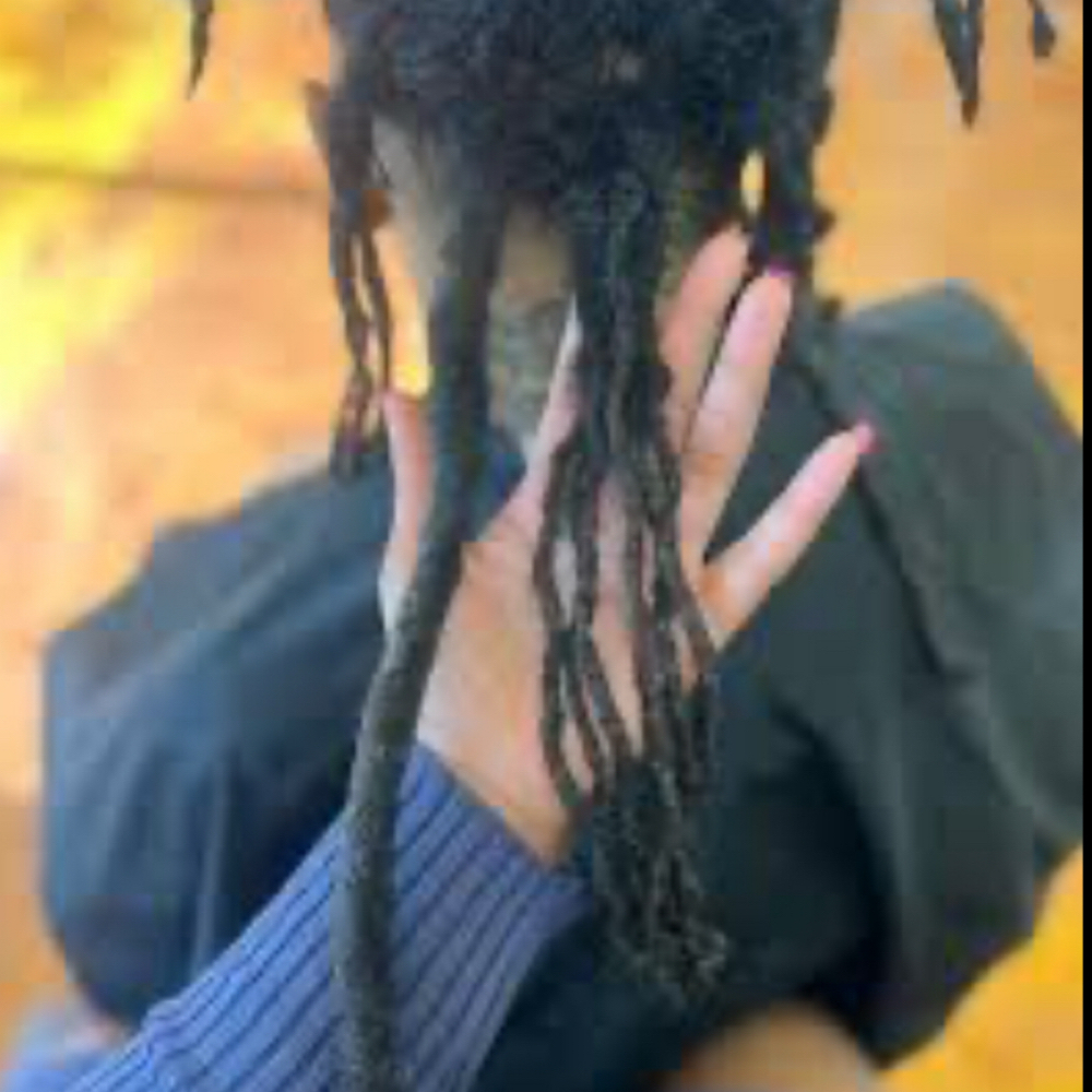Combining Locs at TAI.THE.STYLIST HAIR STUDIO INC. in Dayton, OH
